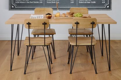 cbf91a1b1eeb6e11e5a2c289088570316a3d28cb72ea184d791e48bb7e78a0df.jpg An Image of Felix Industrial Dining Table / Desk - Solid oak and steel