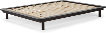 An Image of MADE Essentials Kano platform Kingsize Bed, Black Stain Pine