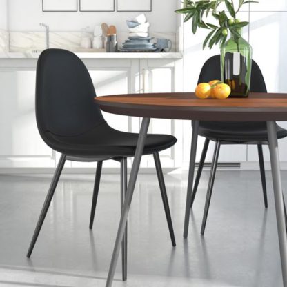 004b0551bad23213a9023a375a95f06802e6cc402ee26a7cd5c0c8b522cb9dd6.jpg An Image of Calvin Black Faux Leather Dining Chairs In Pair