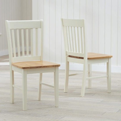 08ab8785968b41650ae68fc2aed0b2f8ed06ec5024f114077484d670c9aa7529.jpg An Image of Fornax Wooden Oak And Cream Dining Chairs In Pair