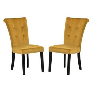 An Image of Wodan Velvet Dining Chair In Mustard With Black Legs In A Pair