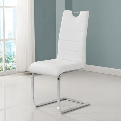 0dfdc2ff3a9f6e085b84f4a108e39f96ed3cd5c092d0e598379918e835ec92c6.jpg An Image of Petra Faux Leather Dining Chair In White