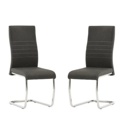 11a556a6bf5c97113ccceda95773017a253cafc03d9a166d63dc46e7b5a51ec4.jpg An Image of Devan Cantilever Dining Chair In Black Faux Leather In A Pair