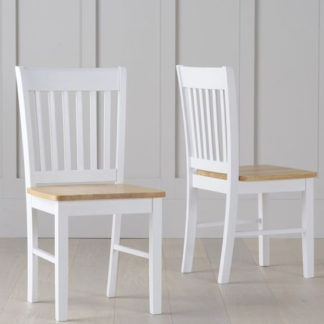 An Image of Sculptor Oak And White Dining Chairs