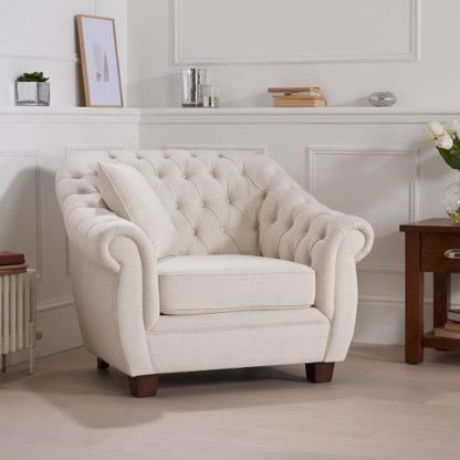 1b8d6f643eeee129ae4c8c5201f9f0a3ce65c1df5bc3014d9ce3c8048fbb1ad8.jpg An Image of Sylvan Chesterfield Style Fabric Sofa Chair In Ivory