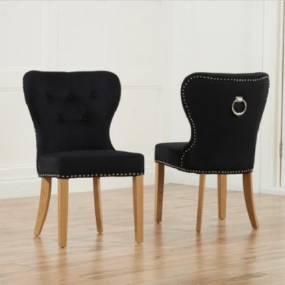 An Image of Wallace Dining Chair In Black Velvet With Oak Legs In A Pair