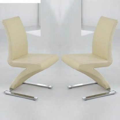 20a4cd75369cfe98c1dd71f730e93edecb4911ac6ea580cf8e1e9b64e62d86a9.jpg An Image of Demi Z Dining Chairs In Cream Faux Leather in A Pair