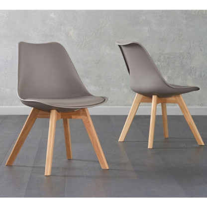 22d03e49c977f66331479acfeefbc869939f32a7a0cdb2eb324ac181c9d5e8a9.jpg An Image of Brachium Taupe Faux Leather Dining Chairs In Pair