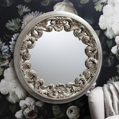 23669eb8f9fd69171e9bfa1c837ad68ff019f011b632bbdb0ad79bf359218374.jpg An Image of Anna Wall Mirror Round In Silver With Ornate Frame