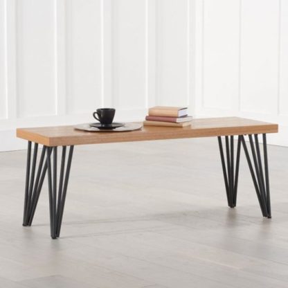 25f7394fb9b80aee6cff688c235f7d8da919b2ac332ba8d46e02ce3f831db1da.jpg An Image of Beid Wooden Dining Bench In Oak With Black Metal Legs