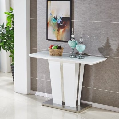 2cd9c8b31c1196560ab09cc286e721daf75f1e8d700163a41c171db301c086ea.jpg An Image of Memphis Console Table In White High Gloss With Glass Top
