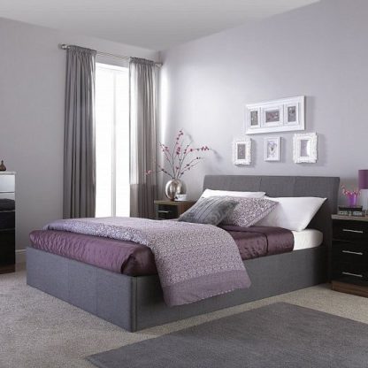 31c039a98a753cb1694e73cf292005ceb46de8908d212ef6c4f42f3a066b3ced.jpg An Image of Keanu Fabric Ottoman Storage King Size Bed In Grey