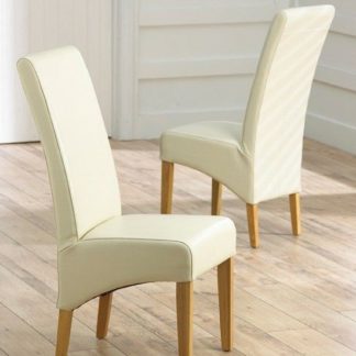 An Image of Choe Cream Bonded Leather Dining Chairs With Oak Legs In A Pair