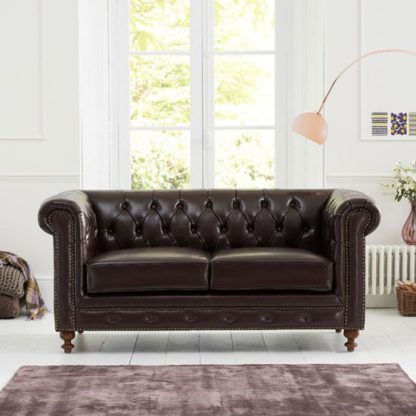 46286a844389f13f6cf7361954a3104715ada97b1561603c0bfa55bba31411c0.jpg An Image of Mentor 2 Seater Sofa In Brown Leather With Dark Ash Legs