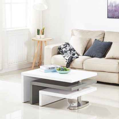 4ec7b2e1eb268637e2fa63736dc28d90fcf9ba35f9ec2629403f80227f48c315.jpg An Image of Design Rotating Coffee Table In White And Grey High Gloss