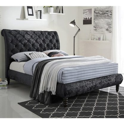 534401f1084e8cb2d115a469a6071894d8fbdab672d47bee4f9dbf1828096e1e.jpg An Image of Venice Velvet King Size Bed In Black With Black Wooden Legs
