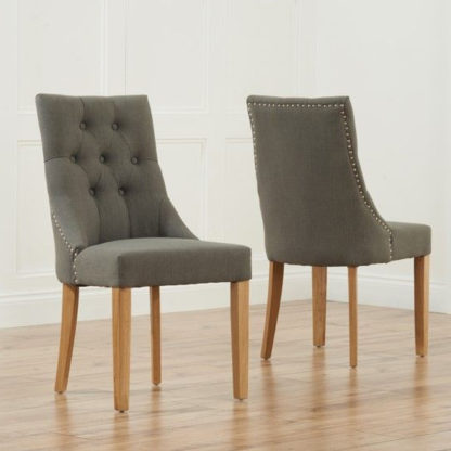 An Image of Anser Grey Dining Chairs In Pair With Solid Oak Legs