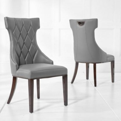 An Image of Tybrook Grey Faux Leather Dining Chair With Wood Legs In A Pair