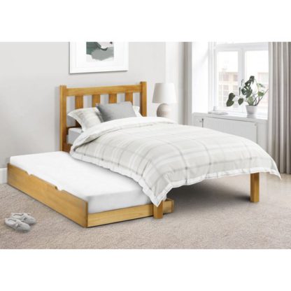 7452054e365305b61fcdc437191bae1785a0e94c18d1f2cc1c7d0860a0c1ec3b.jpg An Image of Poppy Solid Pine Double Bed And Guest Bed In Low Sheen Lacquer