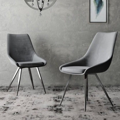 7779b57f02f30044a16bdb50cd4c91eb33d1e1207dec0388f98abbd2e1ed956b.jpg An Image of Lanna Dark Grey Velvet Fabric Dining Chairs In Pair