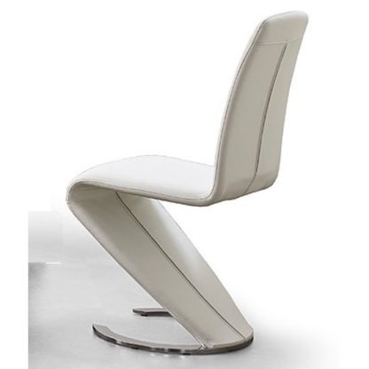 785aa8648d640507c1fa5c578a90e96433126417237a52e4640ee21211814746.jpg An Image of Swing I Metal Swinging White Faux Leather Dining Chair