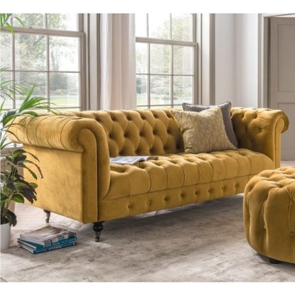 7b283447b6fbcb35ec97cdbbd00e8ca1b699cad61f4b63c690bf5456a41d4a5b.jpg An Image of Reedy Chesterfield Three Seater Sofa In Mustard And Metal Castor