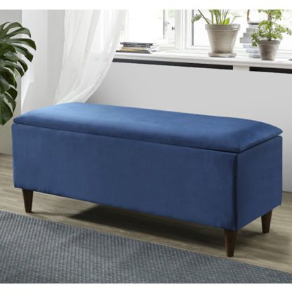 8090dc73c086923ee630678e61f70bedbb3afca863f111bcc8fc3b65c6cb7b54.jpg An Image of Emma Velvet Upholstered Storage Ottoman In Blue