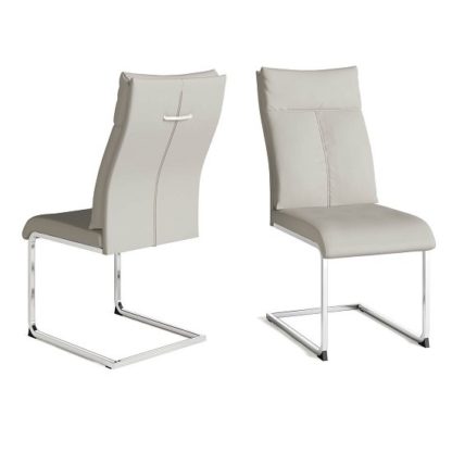 82966729bf24a2544ff74aece24e38736afd48b7ca9586c229940a1298777996.jpg An Image of Chapin Faux Leather Dining Chair In Cream And Chrome Leg In Pair