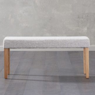 An Image of Miram Small Grey Soft Fabric Dining Bench With Solid Oak Legs