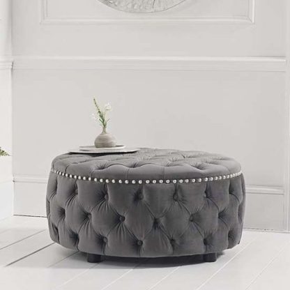 937e8256c114037c504174256910b77c6c00f37e1e03ffbb2cbfe133fa71bb3b.jpg An Image of Aniara Velvet Round Footstool In Grey