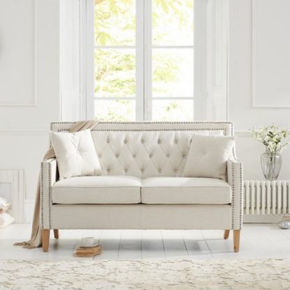 93a7b5b1245483e3a453b25432f2a823f6b12455ac8772ff336f0cb2c1d588f8.jpg An Image of Bellard Fabric 2 Seater Sofa In Ivory White And Natural Ash Legs