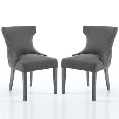 a1faed218525df1273b458c74419a95b0c10a21ec4ee45f85d93201715b1ea69.jpg An Image of Marcel Fabric Dining Chair In Grey With Wooden Legs In A Pair