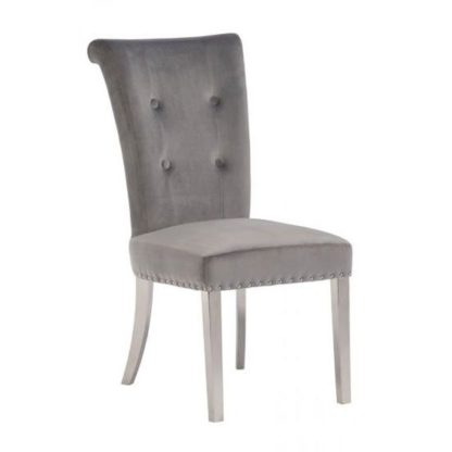 ac0127feaeea7c48cbfb7c912c0d80fc85a2fe33e5fb3622f820cac6f582eccf.jpg An Image of Mitzi Velvet Upholstered Dining Chair In Grey