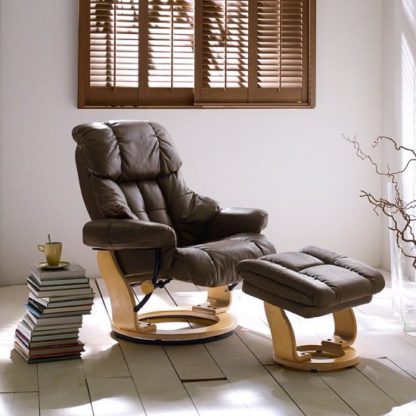 b10e2d6d576745c904afef30d506089c3f74c46f972d8eeca9a3ca12acd19aea.jpg An Image of Calgary Relaxing Chair In Brown Leather And Oak With Foot Stool