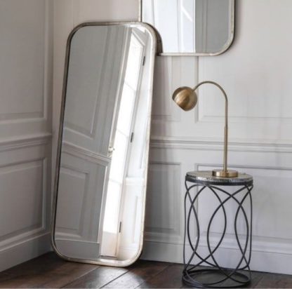 b4aeaa7bee933565e83ff65e4637f1374e7dd7fa308e9cb3c3141c892152d335.jpg An Image of Malcolm Leaner Rectangular Floor Mirror With Metal Frame