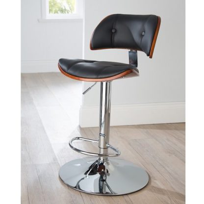 b9b85b7669982bc6f36b9fd8df62499f3626ac9bb74491e6b35984bdabf33986.jpg An Image of Aylesbury Bar Stool In Black PU And Walnut With Chrome Base
