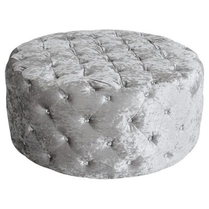 be35e9fae75984e767fe3d7bd8b9e7d5dd735d61bfe8cdee0a2b19e83f2e558d.jpg An Image of Wrigley Fabric Round Pouffe In Crushsed Silver Finish