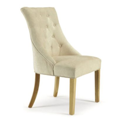 c3f1349bdbe4aa63dda4801196ce2a0b11db30e38cd2675fdf374f7c75285c45.jpg An Image of Milena Dining Chair In Pearl Fabric With Oak Legs in A Pair