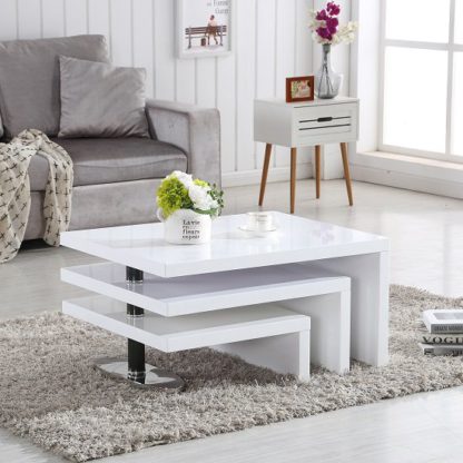 An Image of Design Coffee Table Rotating In White High Gloss With 3 Tops
