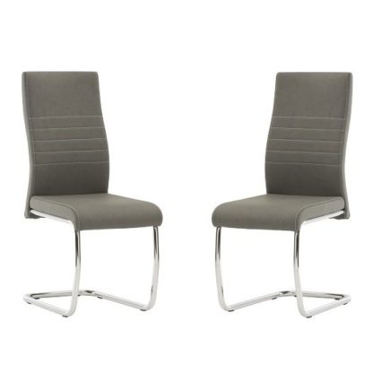cdb418f2d8662a90c0db95e57837cf44f74c43afb88c41c2d94e225a53974cc9.jpg An Image of Devan Cantilever Dining Chair In Grey Faux Leather In A Pair