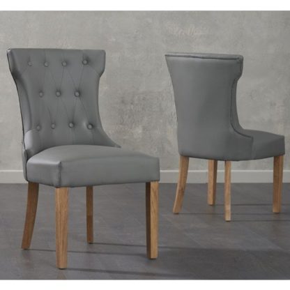 ce092a8a840584754bae102ff9456b585ee2ae7d34ffed4def045ded3df6d757.jpg An Image of Absolutno Grey Faux Leather Dining Chairs In Pair