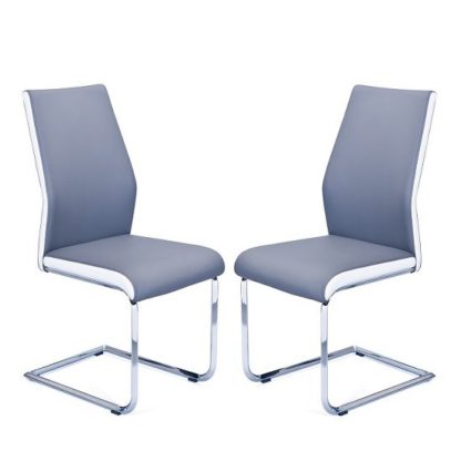 e14326835c15ba2caf4dde954954fca6b8d69ae3e4ef7523aaae04db8afbf0e5.jpg An Image of Marine Dining Chair In Grey And White Faux Leather In A Pair