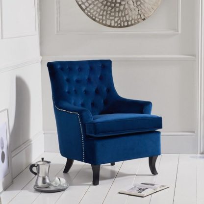 e363c8db9bbb81f0022aba93e8a3668a726907295a648569b6f58ccf75b429b4.jpg An Image of Bartow Modern Accent Chair In Blue Velvet With Black Legs