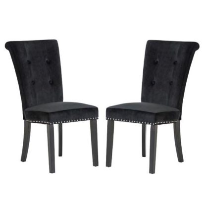 An Image of Wodan Velvet Dining Chair In Black With Black Legs In A Pair