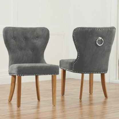 efda4c25e6ffecd8d792e6b609889870460a231e79d2a39010f24295aa556cc3.jpg An Image of Chason Grey Plush Studded Dining Chair In Pair