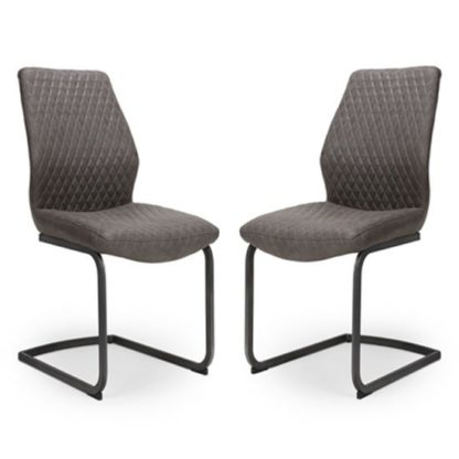 f2fab39e6b4a17e6900f0c3392466e0c31be7290b94eed78d81c06ed4583141c.jpg An Image of Charlie Grey Faux Leather Dining Chairs In A Pair