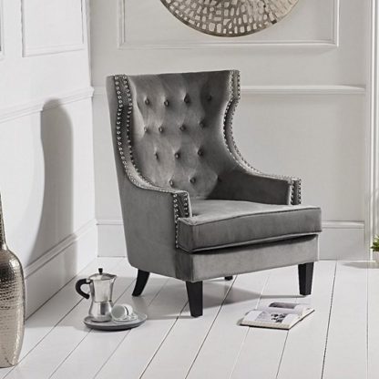 f8f05e08dada2f2b0e615797d87f6862b8079e1d5aa856337bcab101c9d276e3.jpg An Image of Irina Modern Accent Chair In Grey Velvet With Black Legs