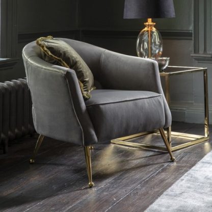 fa3aaa8c5146c7d7b421838fd5ca929fe5c466dddd19cbd3c85b39fc239cb855.jpg An Image of Gerania Velvel Arm Chair In Grey With Gold Metal Legs