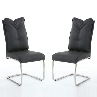 fc6fa7e963264a539bbe9853c077b3cb3b9c520a9777de55fbd3f4180c981dfc.jpg An Image of Aston Modern Dining Chair In Dark Grey Fabric In A Pair