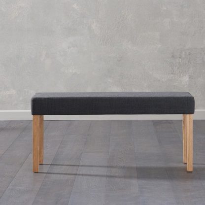 An Image of Birlea Fabric Dining Bench Small In Black With Oak Legs